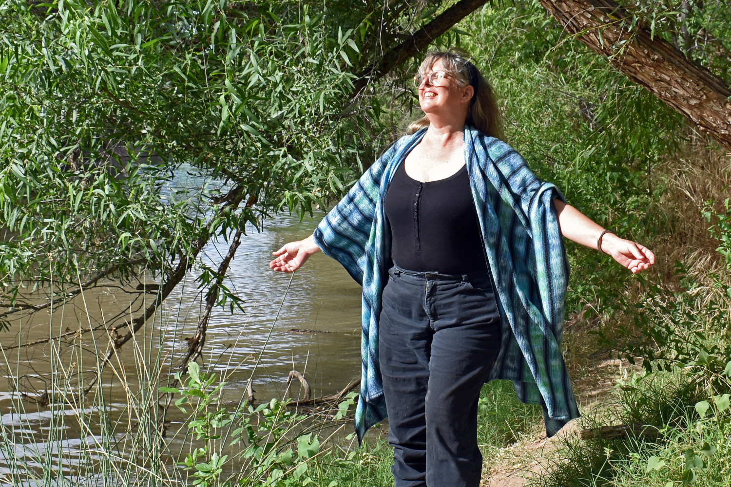 "Mountain Stream" handwoven ruana shawl in blue and green, with light green weft