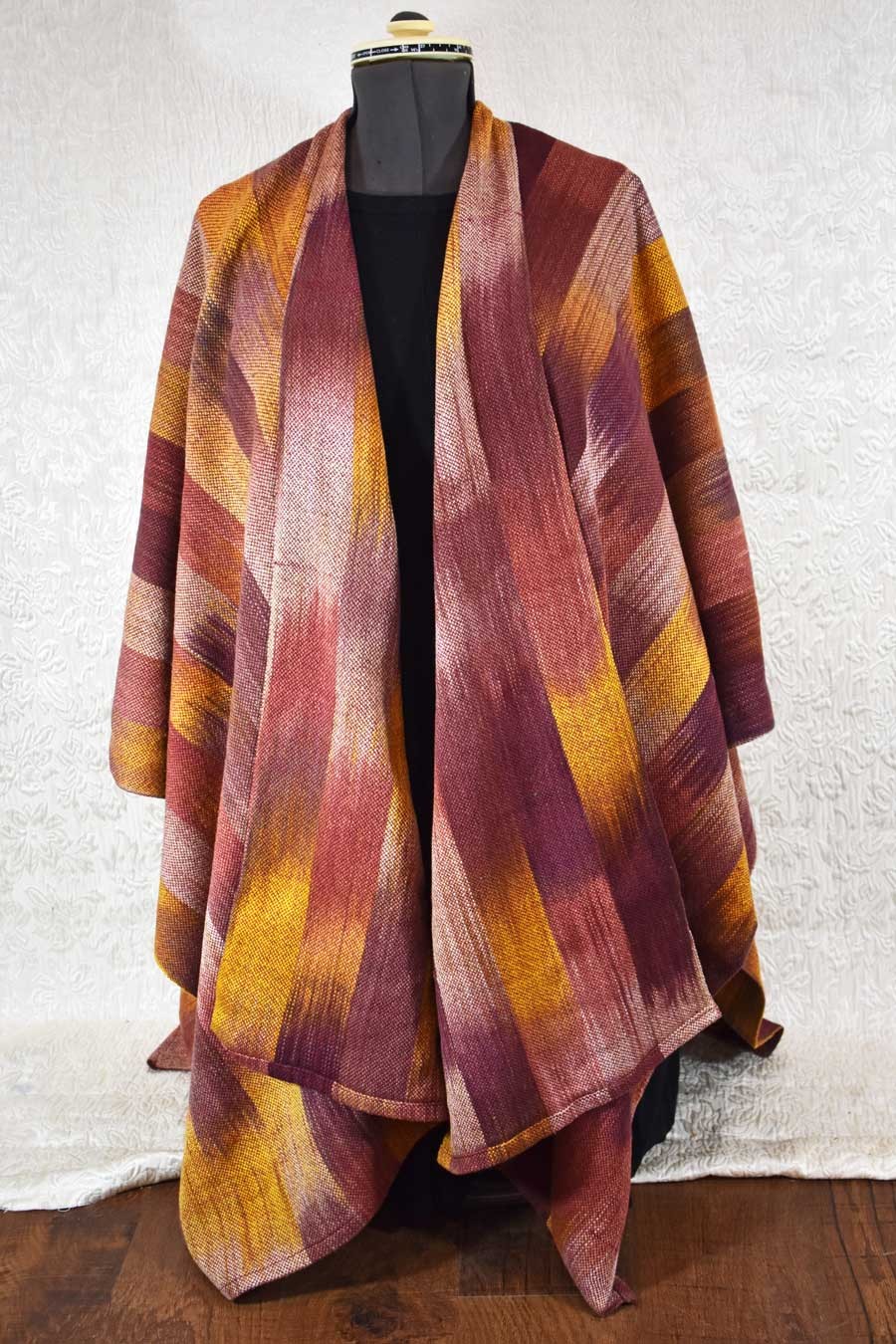 Handwoven, hand dyed ruana in browns, rusts, and yellows