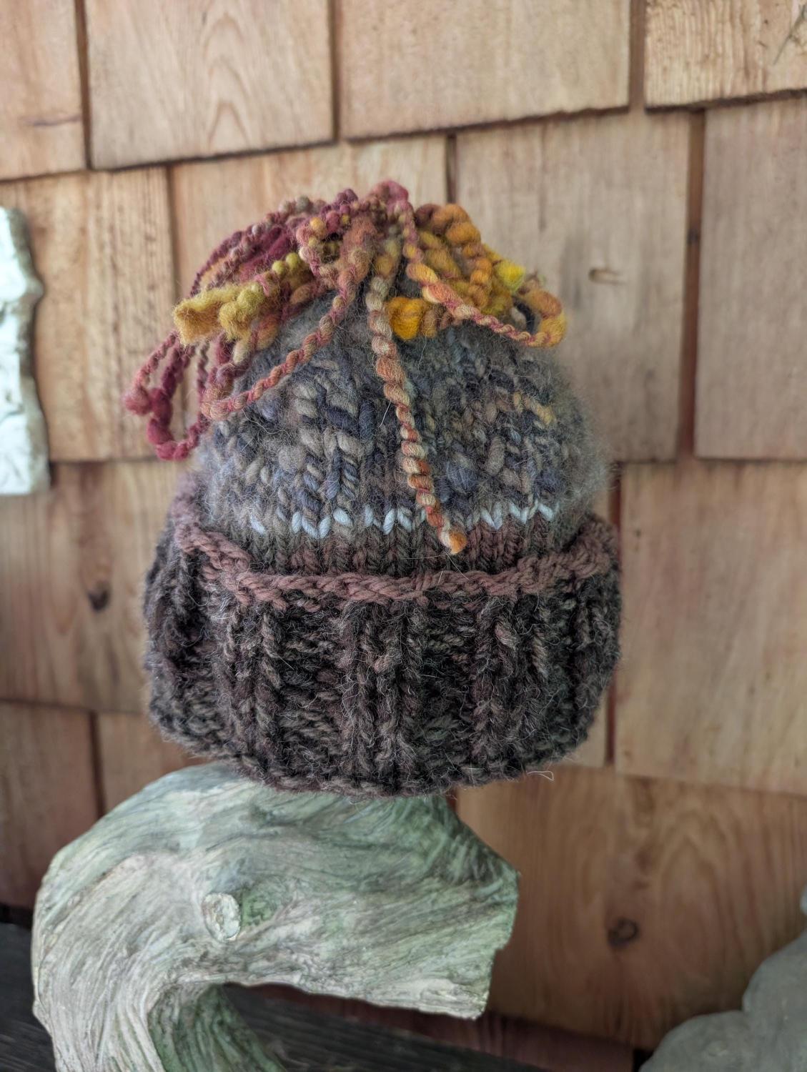 knitted, handspun, hand dyed wool hat. Funky and fun. Nice and warm.