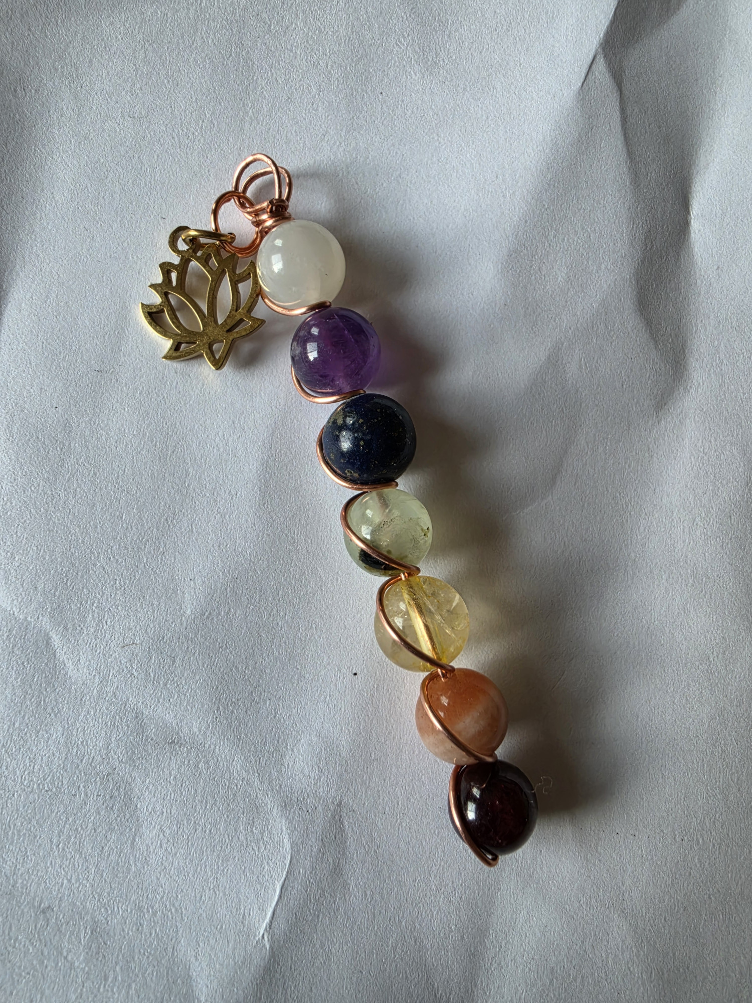 Handcrafted Copper Chakra Pendants with Lotus charm.