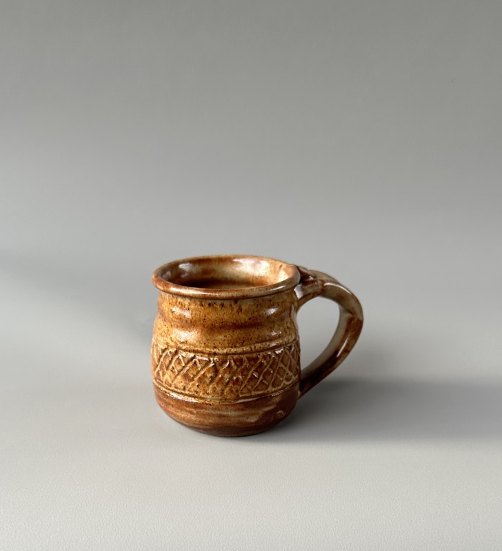 Tan, decorated mug