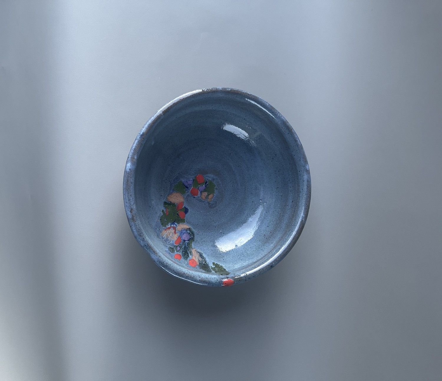 Blue Bowl with a Colorful Design