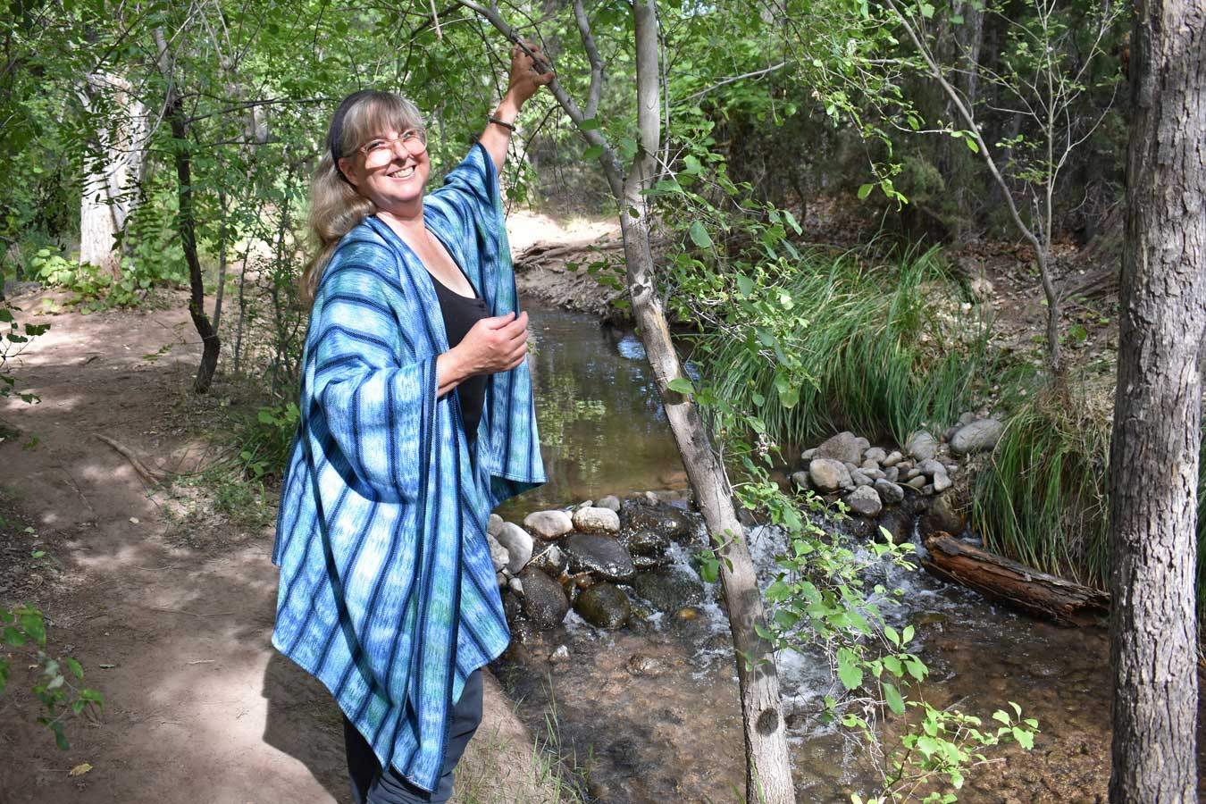 "Mountain Stream" handwoven ruana shawl in blue and green, with turquoise weft