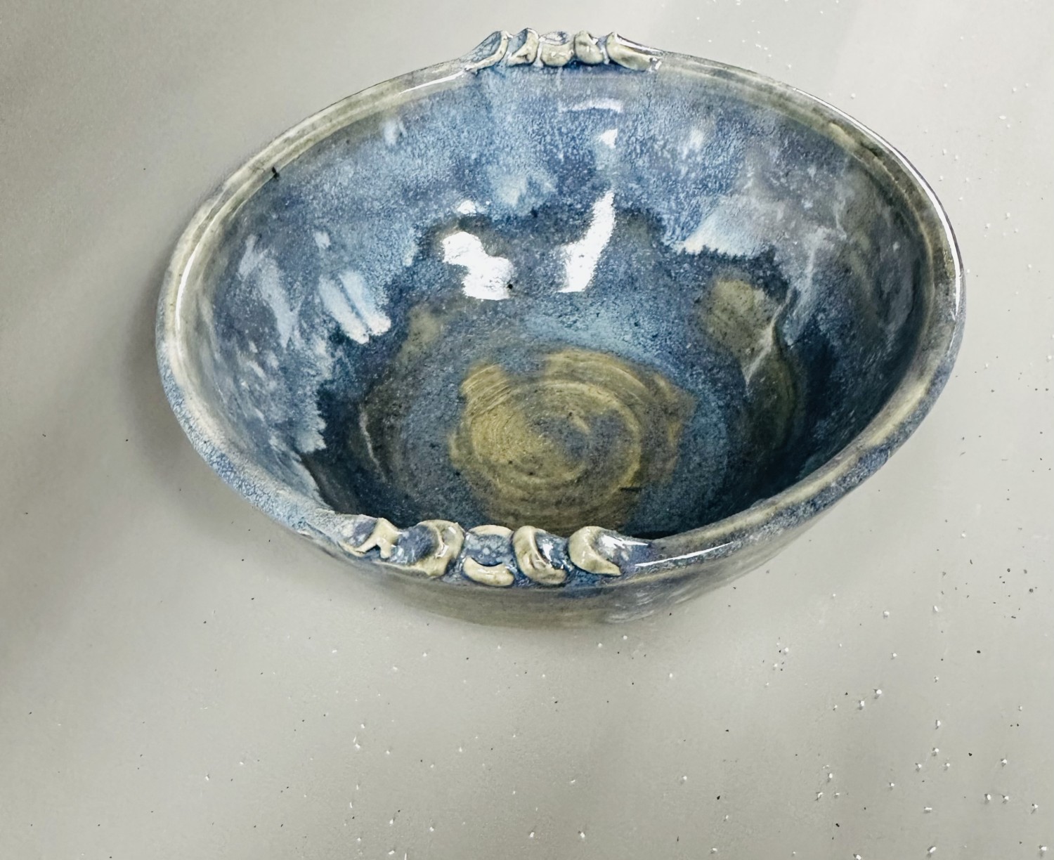 Blue bowl with decorated rim